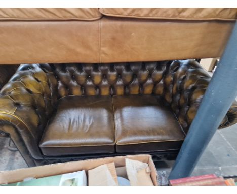 A brown leather Chesterfield sofa. Condition- good, some very slight scuffs around corners etc, no rips, stains, obvious mark