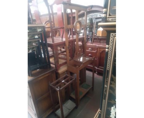 An early 20th century oak hallstand together with an oak stick stand. 