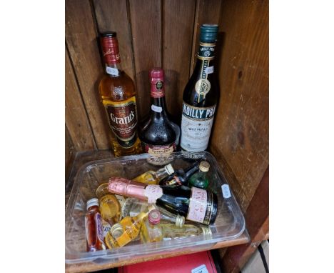 3 bottles of alcohol; a Grant's scotch whisky, a liqueur and a vermouth together with collection of miniatures. 