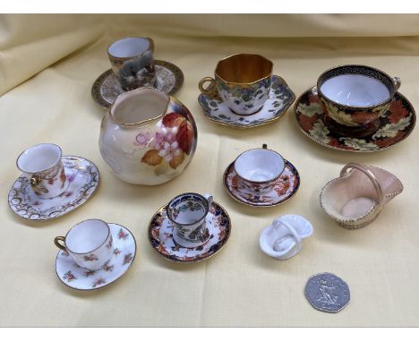 7 miniature cups and saucers including Coalport, Spode, Royal Crown Derby, Masons, together with a royal orcester pot signed 