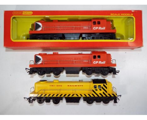 Model Railways - Tri-Ang OO gauge three trams continental diesel locomotives comprising # R1553 x 2 and # R155, one locomotiv