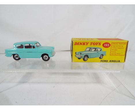 Dinky Toys - A Dinky Toys # 155 Ford Anglia in turquoise with red interior and spun hubs, contained in original, correct box.