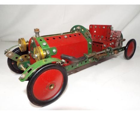 A vintage Meccano rocket car. Estimate £70 - £90