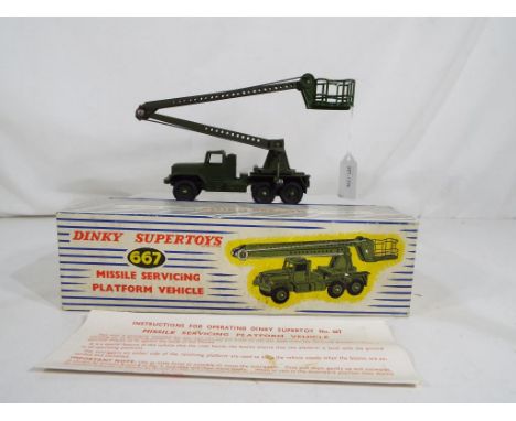 Dinky Supertoys - A Dinky Supertoys # 667 Missile Servicing Platform Vehicle, green body, cab and hubs contained in original 