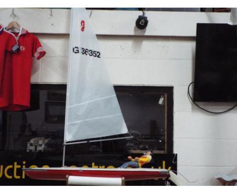 R/C Boats - A white and red plastic sailing yacht by R O Marin, named Jollie, battery operated with moving figure, appears to