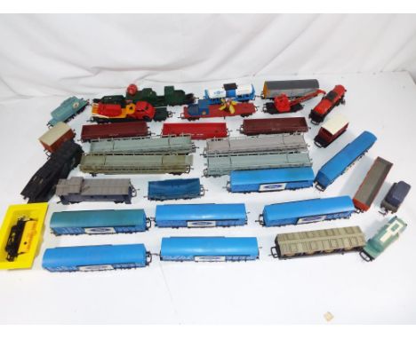 Model Railways - Tri-Ang OO gauge in excess of 30 unboxed wagons, lot includes very rare Ford cars continental ferry vans con