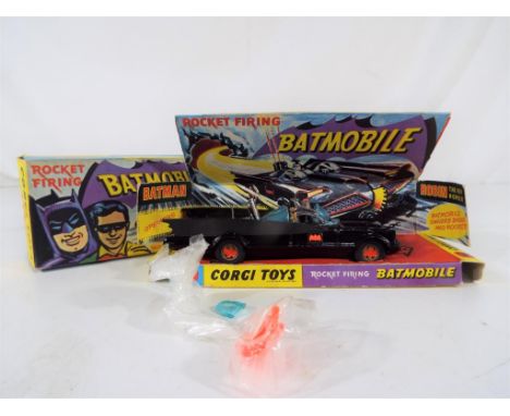 Corgi Toys - Rocket firing Batmobile with Batman and Robin, with nine rockets, exc+ sliding card display tray, leaflet, batmo