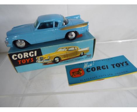 Corgi - Studebaker Golden Hawk # 211 comprising blue body with gold flash, in the original all-card blue picture box (m in mb