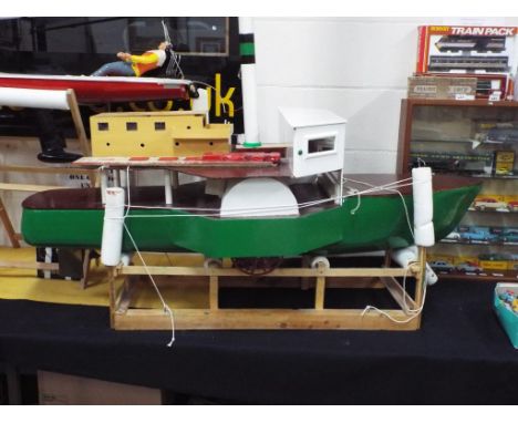 R/C Boats - Lord Brown scratch built battery powered paddle steamer with wooden stand. Approximate height of boat is 92 cm, 1