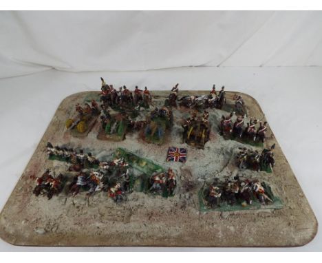 Model Soldiers - a diorama consisting of hand painted metal figures comprising Cavalry, Infantry, Artillery and similar, some