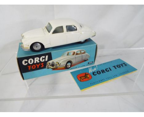 Corgi - Jaguar 2.4 litre Saloon # 208 comprising white body (m in mb) with marketing leaflet in original all-card blue pictur