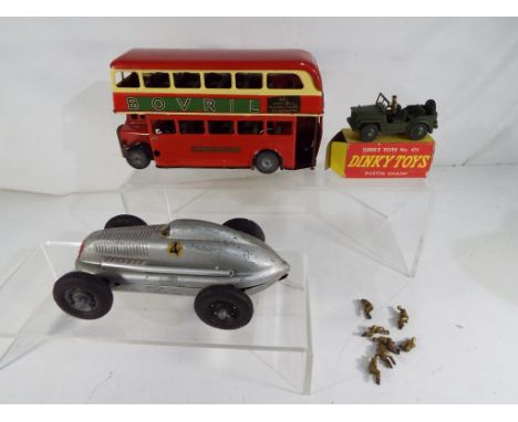 A Dinky Toys # 674 Austin Champ, green body and hubs, with driver, contained in original box model appears E in G box, # 603 