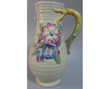 A Clarice Cliff Jug with Floral Relief Decoration, 21cm High 