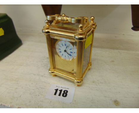 A miniature brass carriage clock, working order