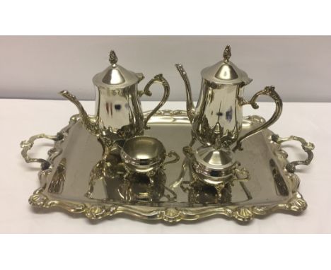 Comprising: teapot, waterpot, milk jug, lidded sugar bowl & handled tray. 