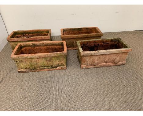 Four terracotta garden troughs with tree themed (H25cm W60cm D30cm)