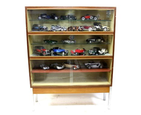 A large selection of classic sports cars in glass display cabinet - includes fifties Mercedes Gullwing, D-Type Jaguar, multip