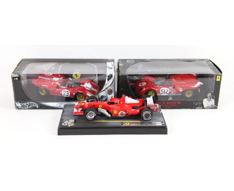 Three Hotwheels 1:18 scale die-cast model Ferraris, comprising Michael Schumacher's Shanghai, Grand Prix of China 2006 (on di