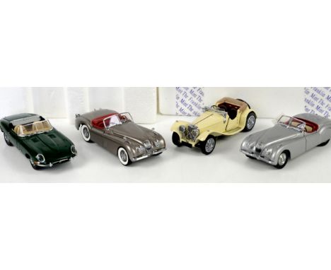 Four Franklin Mint Precision Models, 1:24 scale, to include Jaguar XK 120; Jaguar SS-100; 1961 Jaguar E-Type; and 1949 Jaguar