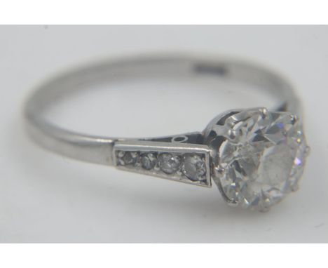 Old cut diamond-set platinum solitaire ring, central diamond 1.38cts and eight shoulder diamonds 0.14cts, eight claw rex sett