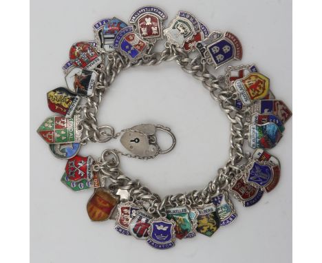 Silver charm bracelet with 34 place name silver charms, 62g. UK P&amp;P Group 0 (£6+VAT for the first lot and £1+VAT for subs