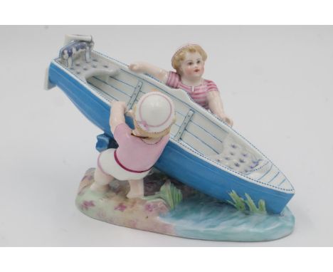 Continental figure of two boys pushing a boat, H: 18cm. UK P&amp;P Group 3 (£30+VAT for the first lot and £8+VAT for subseque