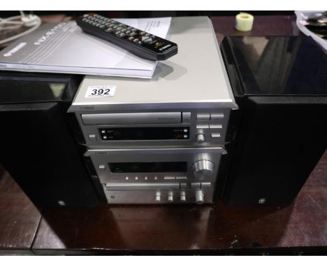 Yamaha music system: KX-E100 stereo cassette deck, CRX-E150 CD Receiver and speaker system NX- E150 with remote. All electric
