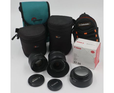 Canon lenses: EFS 18-55mm and 50mm, each with Lowerpro cases and lens hoods, with further accessories. UK P&amp;P Group 2 (£2
