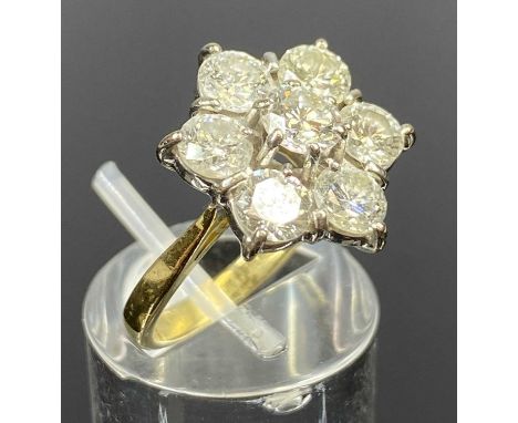18CT YELLOW & WHITE GOLD DIAMOND CLUSTER RING, claw set with central round brilliant cut diamond, within a six round brillian