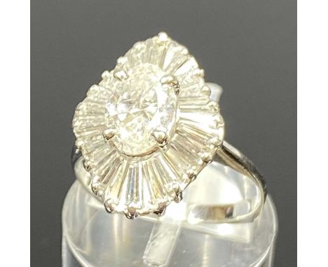 WHITE GOLD DIAMOND BALLERINA RING, oval principal stone within tiered tapered baguette cut diamond surround, size K, 3.8gmsPr