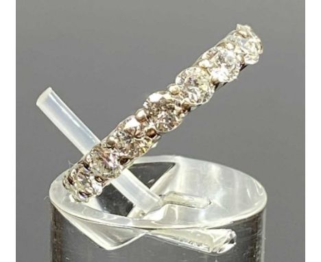 18CT WHITE GOLD FULL HOOP ETERNITY RING, set with 19 brilliant cut claw set diamonds, size K, 3.7gmsProvenance: private colle