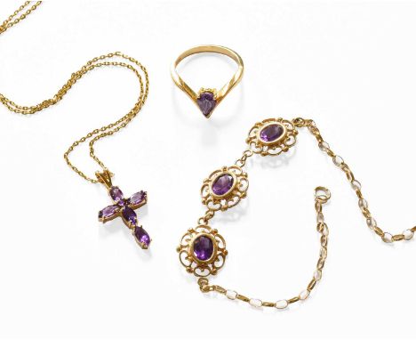 An 18 Carat Gold Amethyst Ring, finger size L; A 9 Carat Gold Amethyst Bracelet, length 18.8cm; and An Amethyst Cross Pendant