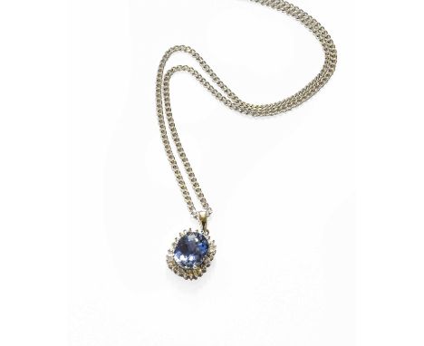 A Synthetic Sapphire and Diamond Pendant on Chain, the oval faceted synthetic sapphire within a border of eight-cut and bague