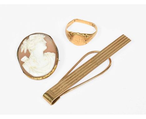 An 18 Carat Gold Signet Ring, out of shape; A 9 Carat Gold Clip; and A Cameo Brooch (a.f.)Signet ring - 6.2 grams. Clip - 8.3