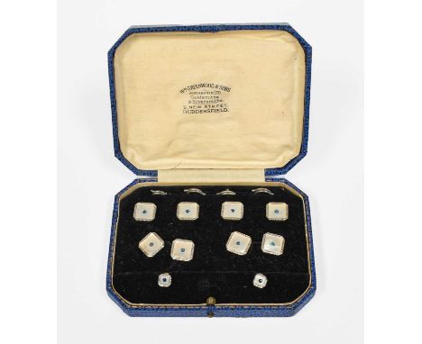 A 9 Carat Gold Mother-of-Pearl Dress Stud, Cufflink and Button Suite, comprising of four buttons, a pair of chain linked cuff