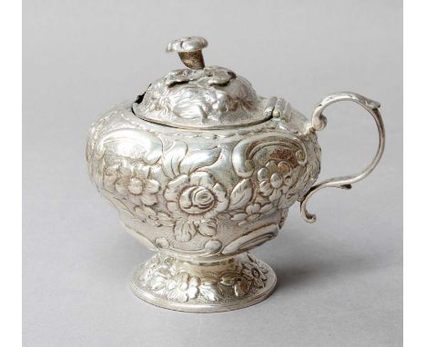 A George IV Silver Mustard-Pot, Maker's Mark IB, London, 1820, tapering and chased with foliage scrolls and flowers on a matt