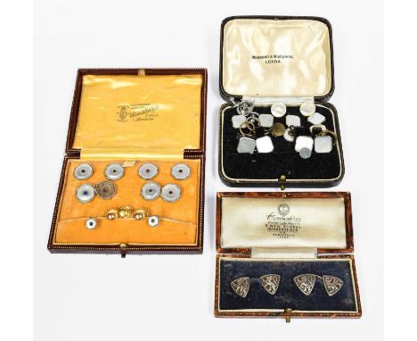 A Mother-of-Pearl Dress Stud, Cufflink and Button Suite, comprising of four buttons, a pair of chain linked cufflinks and two