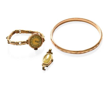 A 9 Carat Gold Bangle, inner measurement 7.00cm diameter; A Watch Head; and A Lady's WristwatchBangle - 8.3 grams. Watch head