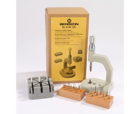 Bergeon No. 6745-100 "press for multi-uses", with plastic strap stand, two wooden stands containing seventeen blades and pins