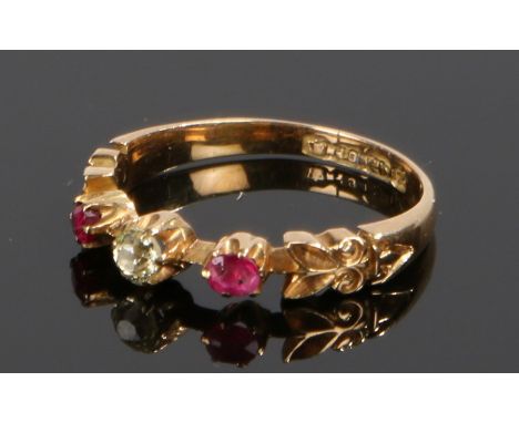 18 carat gold diamond and ruby set ring, with a central diamond flanked by rubies, ring size M