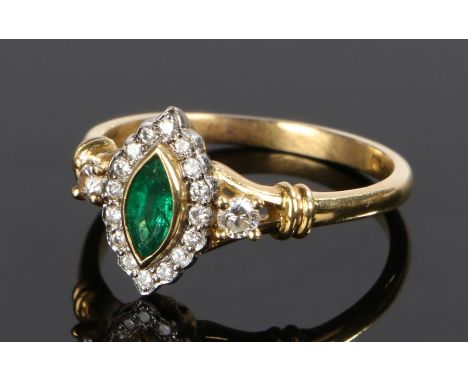 18 carat gold emerald and diamond set ring, with a navette cut emerald and diamond surround, ring size O