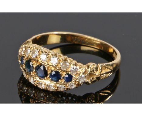 18 carat gold sapphire and diamond set ring, with five sapphires and sixteen diamonds to the edge, ring size P