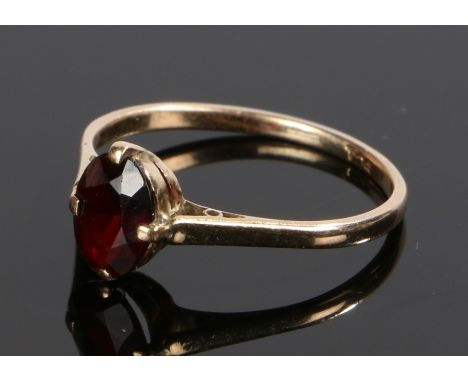 9 carat gold garnet ring, with an oval garnet, ring size R