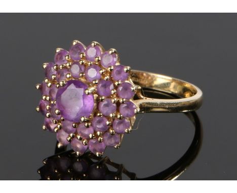 9 carat gold ring, set with a cluster of amethysts to the head, ring size T