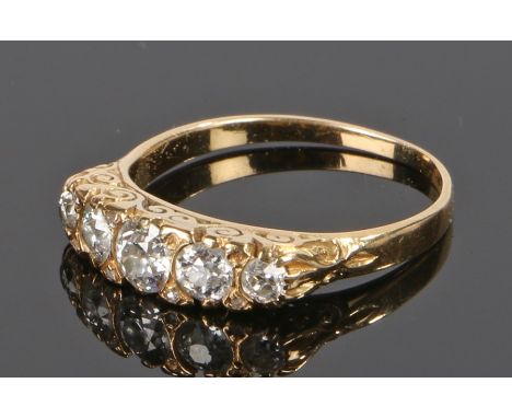 Diamond set ring, with a row of five diamonds to the head, the central diamond approximately 0.45 carat, ring size P