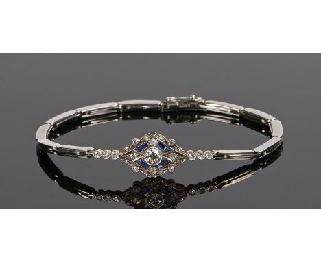 Sapphire and diamond set bracelet, with a central diamond and a surround consisting of further diamonds and sapphires, 17cm l