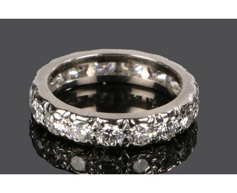Diamond set eternity ring, with round cut diamonds to the white metal shank, the diamonds at an estimated total of 1.99 carat
