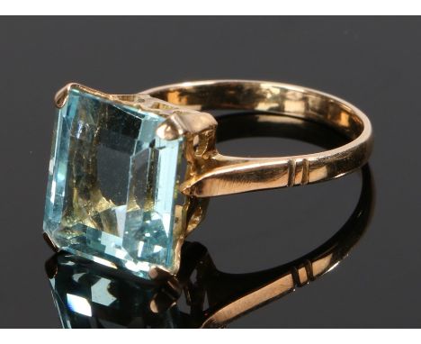 Aquamarine set ring, with a baguette cut aquamarine at an estimated 4.9 carat, ring size M