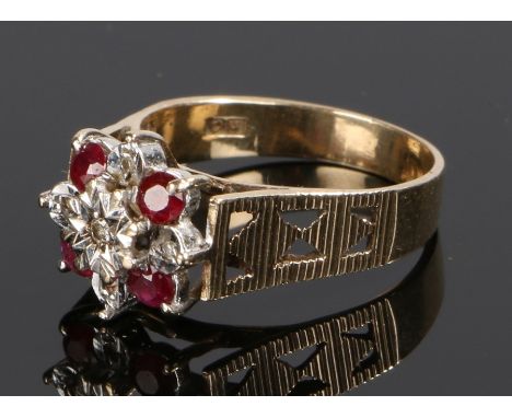 9 carat gold ring ruby set ring, in the form of a flower head, ring size L