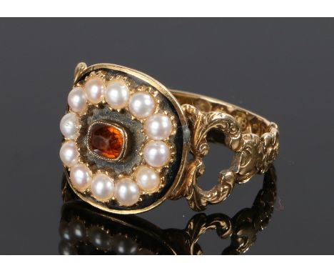 19th Century mourning ring, the orange garnet with pearl surround, the internal rear of the head with the engraved text John 